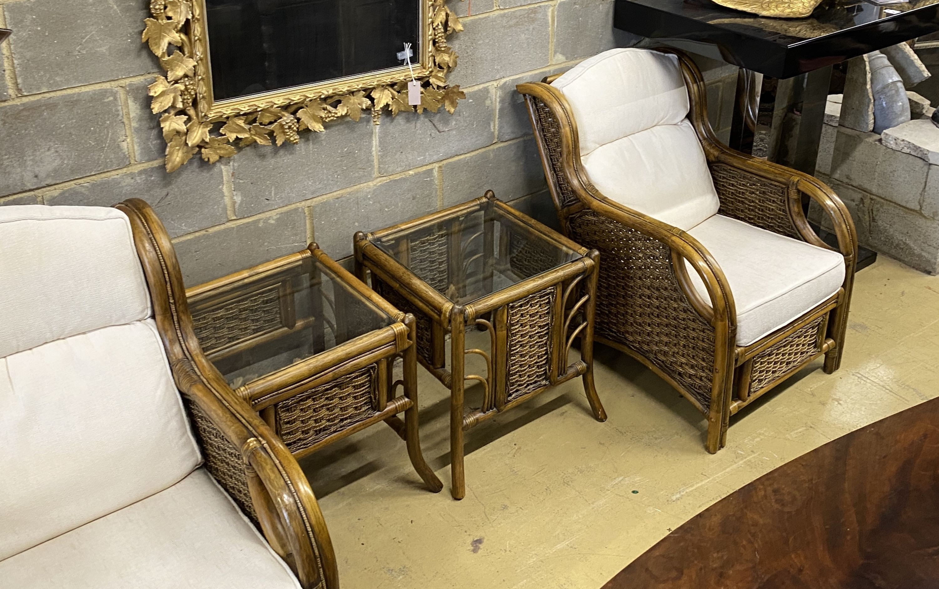 A caned bamboo six piece conservatory suite comprising four armchairs with loose cushions, width 68cm, depth 90cm, height 93cm and two side tables